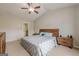 Spacious bedroom featuring a ceiling fan, and matching nightstands at 2705 Maple Park Pl # 29, Cumming, GA 30041