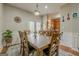 Dining area with hardwood floors, and a view into kitchen with stainless steel appliances at 2705 Maple Park Pl # 29, Cumming, GA 30041