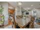 Open-concept dining area with a view into the kitchen and living area at 2705 Maple Park Pl # 29, Cumming, GA 30041