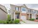 Lovely townhome with a brick facade, covered porch, and well-maintained greenery at 2705 Maple Park Pl # 29, Cumming, GA 30041