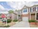 Charming townhome with brick facade, attached garage, and landscaped front yard at 2705 Maple Park Pl # 29, Cumming, GA 30041