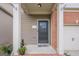 Inviting front porch with brick accents and a decorative door at 2705 Maple Park Pl # 29, Cumming, GA 30041