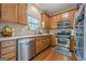 Well-equipped kitchen with stainless steel appliances and beautiful wooden cabinetry at 2705 Maple Park Pl # 29, Cumming, GA 30041