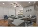 Spacious living room with large sectional sofa and decorative wall panels at 2705 Maple Park Pl # 29, Cumming, GA 30041