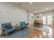 Bright sitting area with stylish blue chairs and decorative wall panels at 2705 Maple Park Pl # 29, Cumming, GA 30041