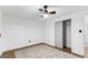 Bedroom featuring ceiling fan, ample closet space and a neutral color palette at 6490 Cainwood Dr, Atlanta, GA 30349