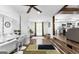Open dining area and living room with wood flooring and stylish lighting at 6490 Cainwood Dr, Atlanta, GA 30349
