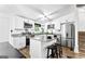 Modern kitchen with white cabinets, stainless steel appliances, and granite countertops at 6490 Cainwood Dr, Atlanta, GA 30349
