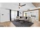 Comfortable living room with modern ceiling fan and dark grey rug at 6490 Cainwood Dr, Atlanta, GA 30349