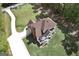 Aerial view of a large home with a spacious backyard and a long driveway and bordered by a black chain-link fence at 20 Allie Dr, Mcdonough, GA 30252