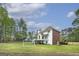 Spacious backyard with deck, white siding, and lush lawn at 20 Allie Dr, Mcdonough, GA 30252