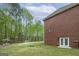Expansive backyard with lush green grass, mature trees, and a gazebo and playground off in the distance at 20 Allie Dr, Mcdonough, GA 30252