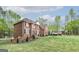 Side view of the home, showcasing the brick exterior and manicured landscaping at 20 Allie Dr, Mcdonough, GA 30252