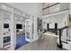 Open interior with hardwood floors and access to a play room; living space with views of a second floor loft at 20 Allie Dr, Mcdonough, GA 30252