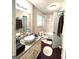 Bright bathroom featuring a modern vessel sink, granite countertops and a shower-tub combination at 579 Wexwood Dr, Riverdale, GA 30274