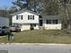 Charming two-story home with black shutters and a well-maintained front yard in a suburban neighborhood at 579 Wexwood Dr, Riverdale, GA 30274