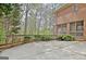 Expansive concrete back patio with wooded views, offering a private outdoor space at 285 Broadmoor Dr, Fayetteville, GA 30215