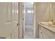 Bright bathroom with white vanity, shower and tub with tile surround and modern fixtures at 285 Broadmoor Dr, Fayetteville, GA 30215