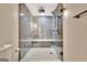 Modern bathroom showcasing a glass enclosed shower, sleek fixtures, and decorative tile floors at 285 Broadmoor Dr, Fayetteville, GA 30215