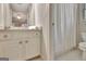 Neutral bathroom with white vanity, white tile, and view into bedroom at 285 Broadmoor Dr, Fayetteville, GA 30215