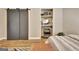Bedroom with modern sliding doors to the closet, beverage cooler and a stylish rug at 285 Broadmoor Dr, Fayetteville, GA 30215