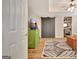 Open bedroom with modern black sliding doors, a green cabinet, and stylish neutral rug at 285 Broadmoor Dr, Fayetteville, GA 30215