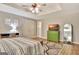 Bright bedroom with a tray ceiling, ensuite bathroom, a green cabinet and a stylish rug at 285 Broadmoor Dr, Fayetteville, GA 30215