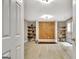 Bonus room features a unique wood accent wall, and built-in shelving, creating a modern and inviting atmosphere at 285 Broadmoor Dr, Fayetteville, GA 30215