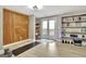 Bright bonus room featuring hardwood floors, stylish wall decor, and shelving for organized storage at 285 Broadmoor Dr, Fayetteville, GA 30215