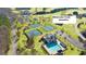 Aerial view of community amenities, including tennis courts and a sparkling swimming pool at 285 Broadmoor Dr, Fayetteville, GA 30215