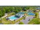 Aerial view featuring a large swimming pool, clubhouse, tennis courts, and playground at 285 Broadmoor Dr, Fayetteville, GA 30215