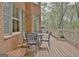 Spacious wooden deck with outdoor dining, ideal for gatherings at 285 Broadmoor Dr, Fayetteville, GA 30215