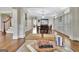Bright dining room with hardwood floors, tray ceiling, and views into the living area at 285 Broadmoor Dr, Fayetteville, GA 30215