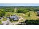 Scenic aerial view of the golf course and clubhouse, set amidst lush greenery and rolling hills at 285 Broadmoor Dr, Fayetteville, GA 30215
