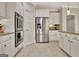 Modern kitchen with stainless steel appliances, granite countertops, and ample cabinet space at 285 Broadmoor Dr, Fayetteville, GA 30215
