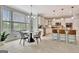 Eat-in kitchen features a center island, stainless appliances, and views of the backyard at 285 Broadmoor Dr, Fayetteville, GA 30215