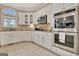Gourmet kitchen with stainless steel appliances, custom cabinets, and granite countertops at 285 Broadmoor Dr, Fayetteville, GA 30215