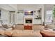 Bright living area featuring a fireplace, built-ins, and hardwood floors at 285 Broadmoor Dr, Fayetteville, GA 30215