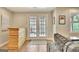 View of the living room with a wooden bar area and access to the exterior patio and view from the window at 285 Broadmoor Dr, Fayetteville, GA 30215