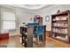 Home office with a custom desk, built-in shelving, and hardwood floors for a productive workspace at 285 Broadmoor Dr, Fayetteville, GA 30215