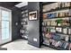 Office bookcase against a black wall at 285 Broadmoor Dr, Fayetteville, GA 30215