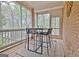 Inviting screened porch with views, a table, and chairs at 285 Broadmoor Dr, Fayetteville, GA 30215