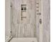 Modern shower with stylish tile and a built-in shampoo niche at 285 Broadmoor Dr, Fayetteville, GA 30215