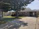 Well maintained tan home with a covered carport area and long concrete driveway at 4365 Newton Cir, Douglasville, GA 30134