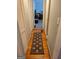 Hallway with wood floors and neutral walls featuring a decorative rug at 4365 Newton Cir, Douglasville, GA 30134
