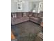 Inviting living room with a large comfortable sectional sofa and neutral gray color palette at 4365 Newton Cir, Douglasville, GA 30134
