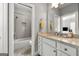 Bright bathroom featuring a shower-tub combo and a vanity with ample storage at 2940 Parkridge Ne Dr, Brookhaven, GA 30319