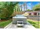 Backyard with a modern hot tub and steps leading to the seating area in the landscaped yard at 2940 Parkridge Ne Dr, Brookhaven, GA 30319