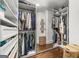 Well-lit walk-in closet with custom shelving and built-in storage units and a mirror at 2940 Parkridge Ne Dr, Brookhaven, GA 30319