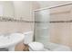 Well-lit bathroom with a single sink and glass-enclosed shower at 1508 Bonanza Church Rd, Jonesboro, GA 30238